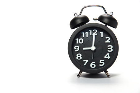 Black alarm clock  on white backgroundの写真素材