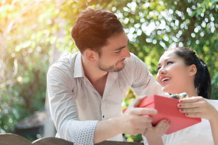 Couple giving gifts to each otherの写真素材