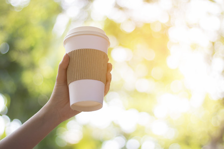 A cup of coffee in bokeh blurred backgroundの写真素材