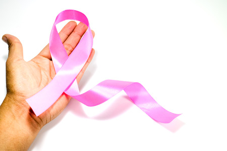 Pink fabric ribbons on hand, white background, concept of campaign help patients with breast cancer.の写真素材