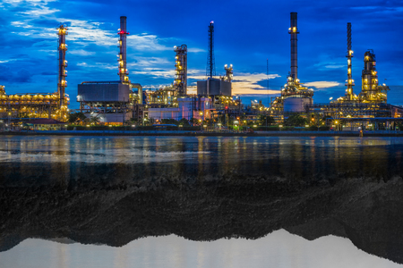 Photo refineries reflect the natural mountain water is black and white. The media industry to destroy nature.の写真素材
