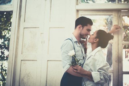 Couple standing by the window in the morning.の写真素材