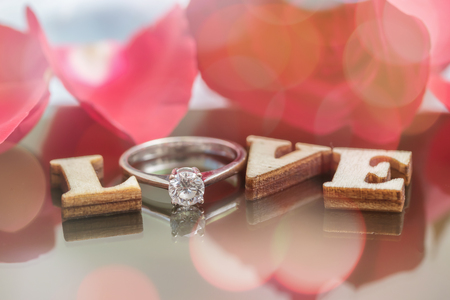Say love via diamond ring and red rose to your lovers in Valentine's Day.の写真素材