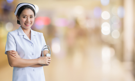 Asian nurse in blurred backgroundの写真素材