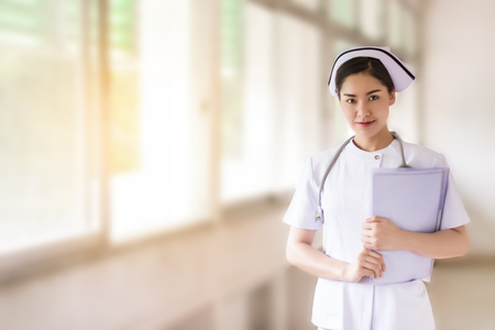 Close up of Asian nurse in blurred backgroundの写真素材