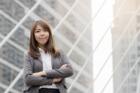 Portrait Of Asian Businesswoman Outside Office and standing proud and successful in suitの写真素材