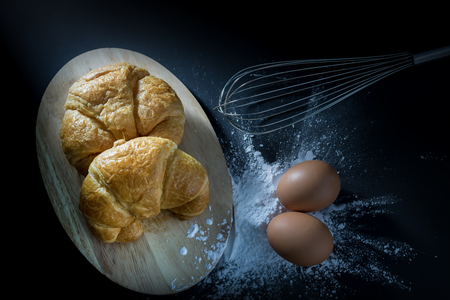 Croissant, with egg and flour.の写真素材