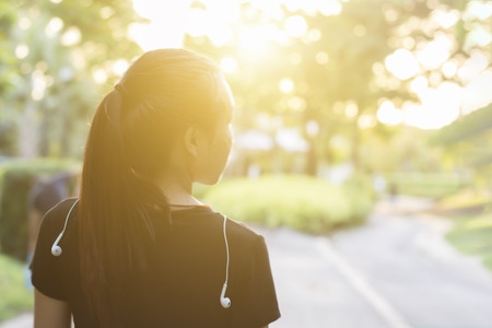 Runner woman running in the gardenの写真素材