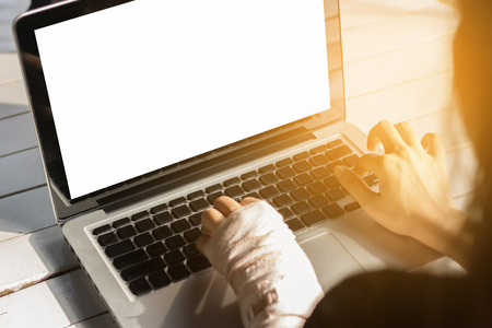 Women injured using notebooks, life insurance conceptの写真素材