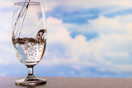 Drinking water poured into the glass.