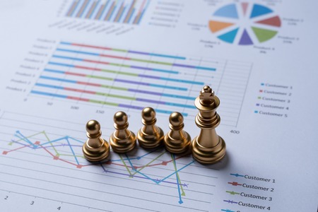 Chess on business report.business and financial concept.の写真素材