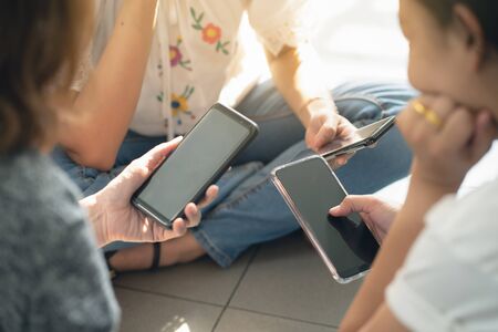 group of people using smart phone for online shopping or ecommerce concept 