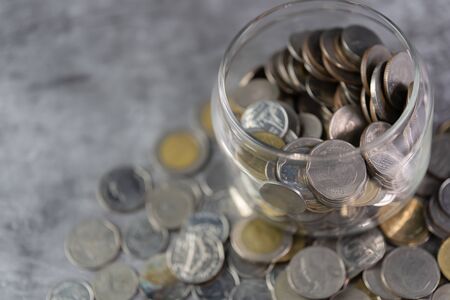 Coins in a glass jar Savings and investment savingsの写真素材