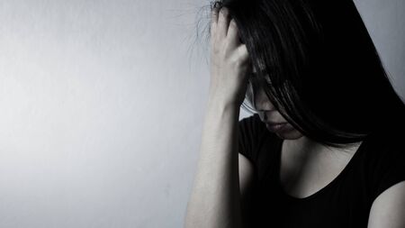 Asian women are feeling sad and stressed.の写真素材
