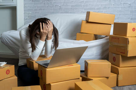 Young Asian women shop online  are stressed . After customers claim productsの写真素材