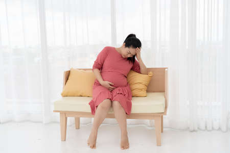 Pregnant women feel headaches and fever.の写真素材