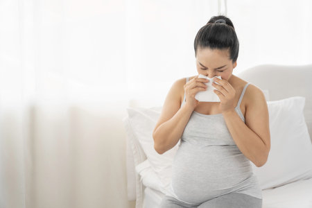 Sick Asian pregnant woman are restingの写真素材