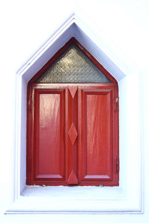 Wood windows on the ground wrapped in red and white colors stand taken in Samut Prakan province, Thailandの写真素材