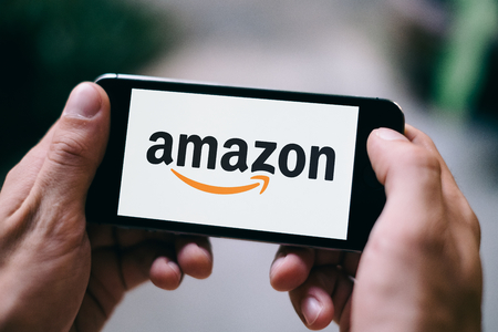 Closeup of iPhone screen with white AMAZON APP LOGO and ICONのeditorial素材
