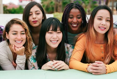 Friendship, leisure and summer concept - group of happy smiling friends outdoors. tourism, travel, people, leisure and technology concept.  - imageの写真素材
