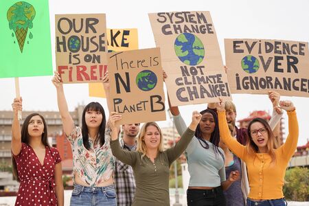 People protesting against multicultural opinion. Young people from diferent countries showing their ideology. Yought together under same defense - Imageの写真素材