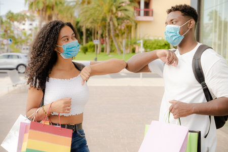 New social distancing greet with elbows for preventing corona virus spread. Couple no kissing for virus. Covid 19 concept.の写真素材