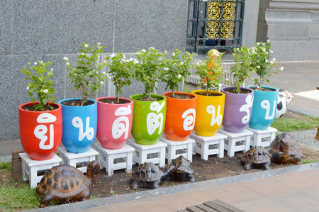 Clay pots and painting with welcome message の写真素材