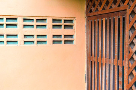 orange cemant wall and wood wallの写真素材