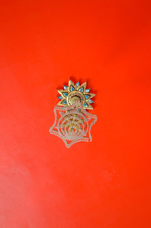 thai lamp on red ceilingの写真素材