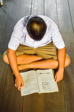 child Thailand student reading a book