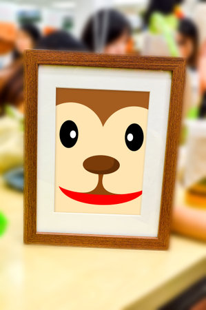 monkey face catoon in picture frameの写真素材