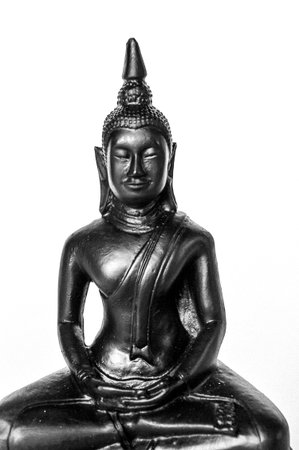 black buddha statue on white backgroundの写真素材