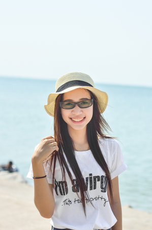 cute asia girl on the beachの写真素材