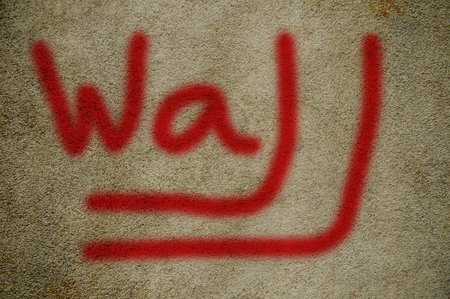 word on cement wall (wall)の写真素材