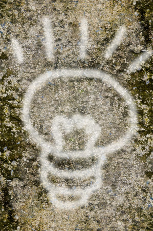 bulb on cement wallの写真素材