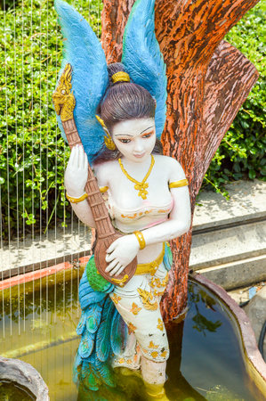 lady statue in gardenの写真素材