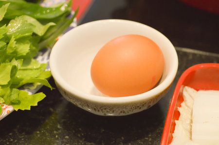 egg on plastic dishの写真素材