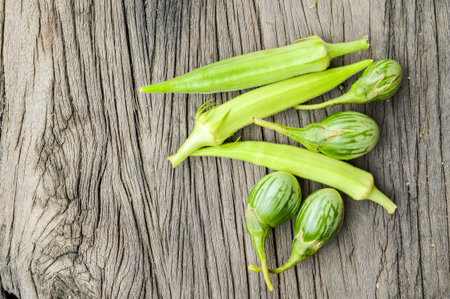 eggplant and Okra on wooden floor
