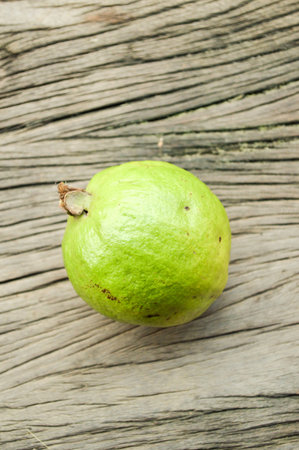 green Guava on wooden floorの写真素材