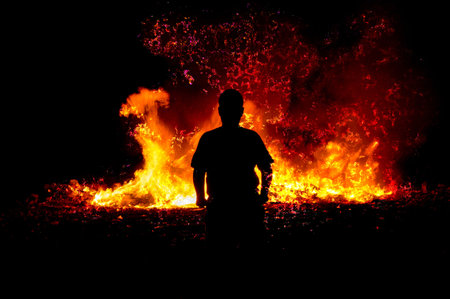 Shadow boy front of the fireの写真素材