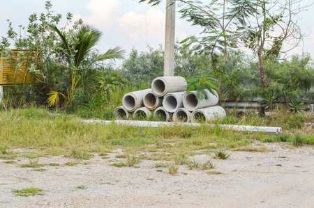 Cement tube and cement pole on the groundの写真素材