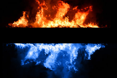 Blue and red fire on black backgroundの写真素材