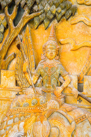 An ancient mural wood carving in Thai templeの写真素材