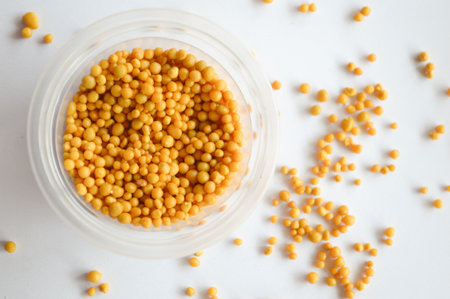 brown fertilizer pellets on white backgroundの写真素材