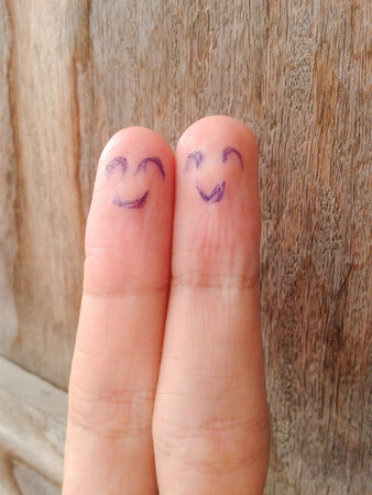 two happy fingers on wood floorの写真素材