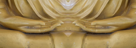 gold buddha statue focus hand in temple thailandの写真素材