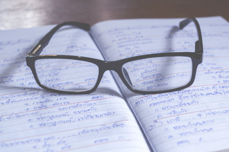 Glasses on paperの写真素材