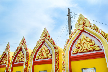 yellow pagoda in public temple Thailandの写真素材