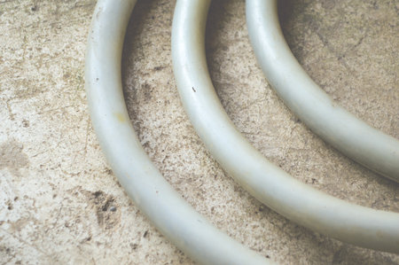 old rubber band on cement floorの写真素材