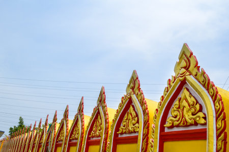 yellow pagoda in public temple Thailandの写真素材